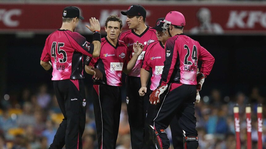 The Sixers' Steve O'Keefe celebrates with team-mates after dismissing the Heat's Ben Cutting.