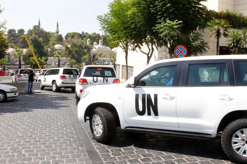 UN inspectors are transported to chemical attack scene