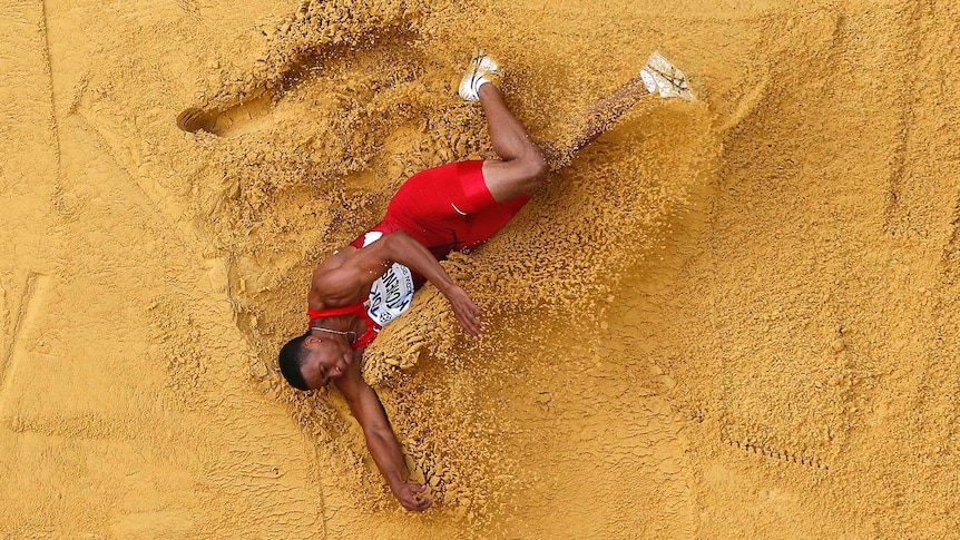 George Kitchens of the US competes in the long jump