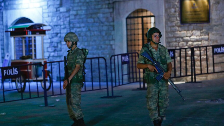 Turkish military stand guard near the Taksim Square in Istanbul, Turkey, during an attempted overthrow of the government.
