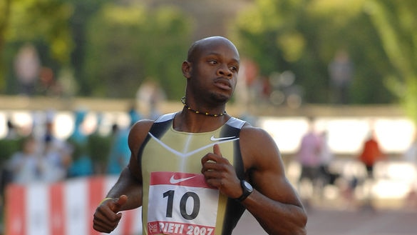 Jamaican Asafa Powell sets a new men's world 100m record