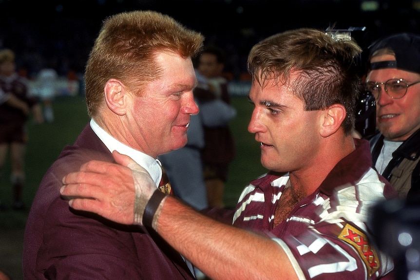 Two men celebrate winning a State of Origin series