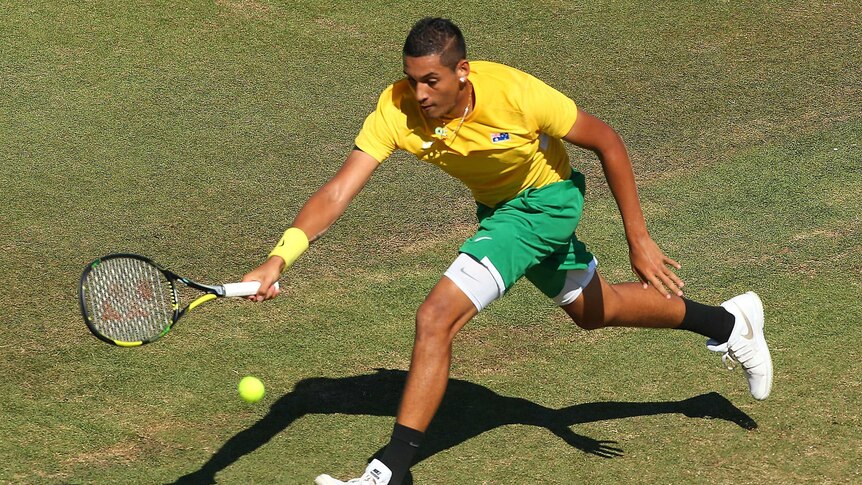 Kyrgios stretches for a forehand
