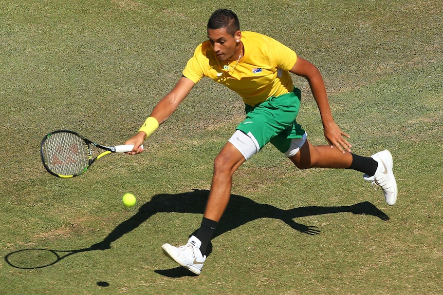 Straight sets ... Nick Kyrgios stretches for a forehand against Denis Istomin