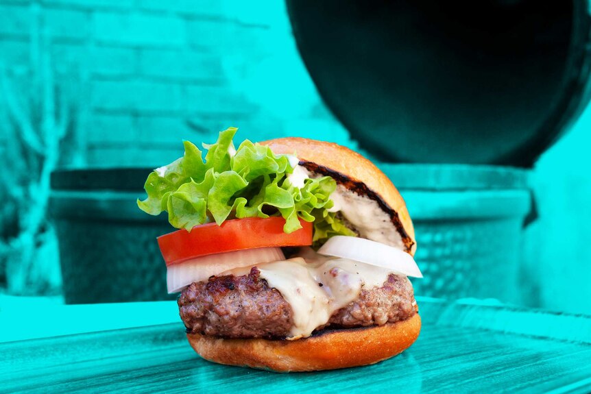 A barbeque beef burger that's loaded with salad, cheese and sauce to entertain friends - to illustrate our simple recipe.