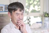 Xiaoming Li becomes tearful when he recalls his experience as a soldier during the Tiananmen massacre.