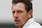 James Pattinson glares at a Queensland batsman