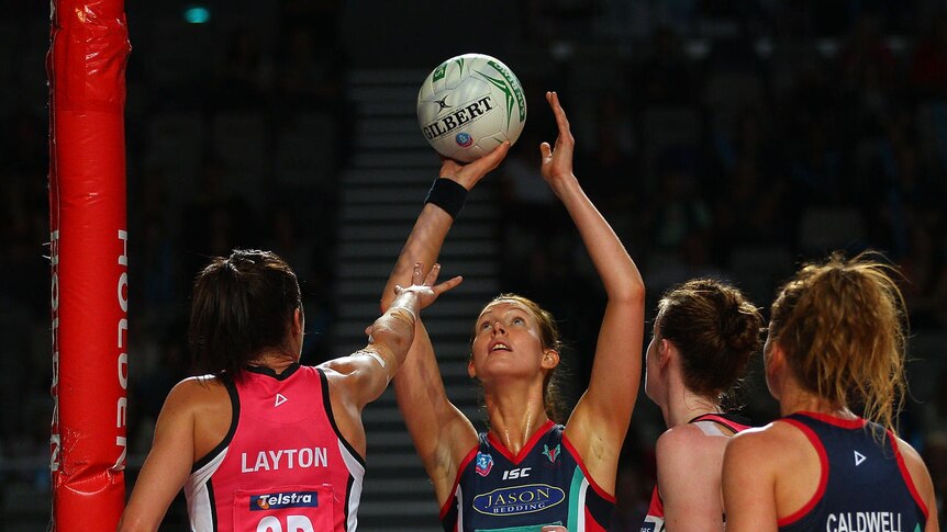 Friend or foe ... the Vixens' Kate Beveridge shoots under pressure from her old club.