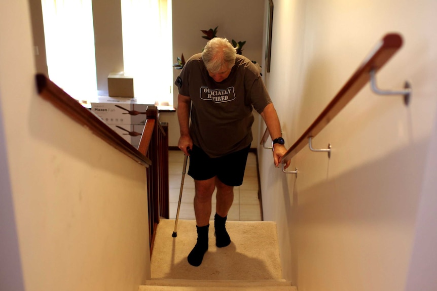 Tony Wallace at the bottom of the stairs.