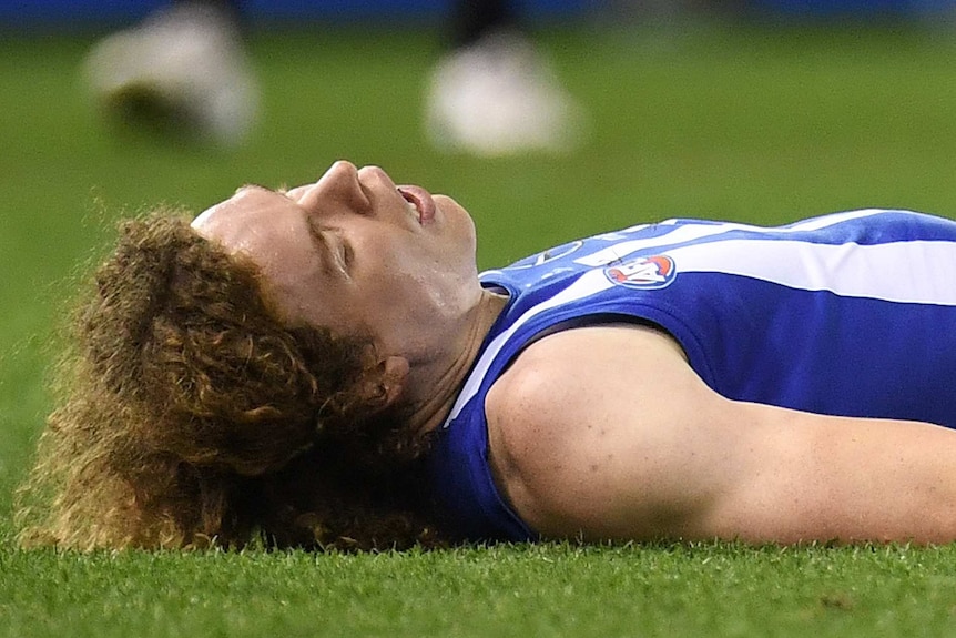 Ben Brown lies unconscious on the turf.