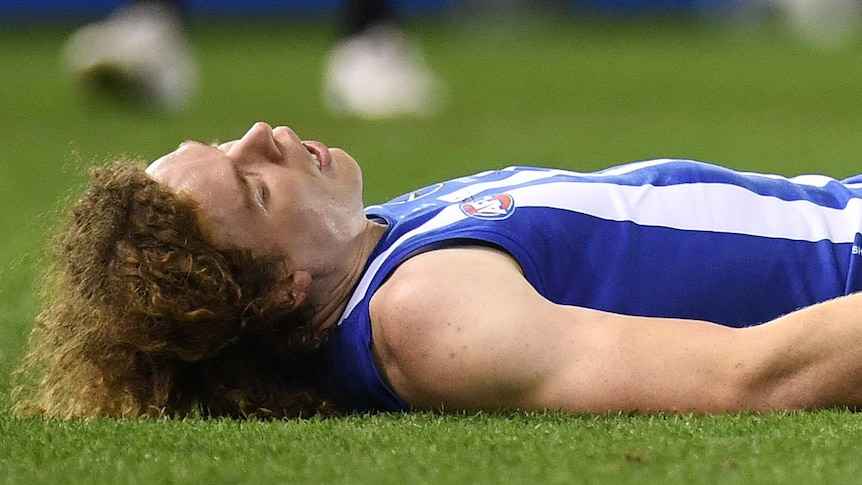 Ben Brown lies unconscious on the turf.