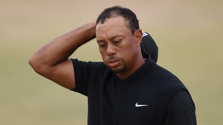 Tiger Woods grimaces after US Open struggles
