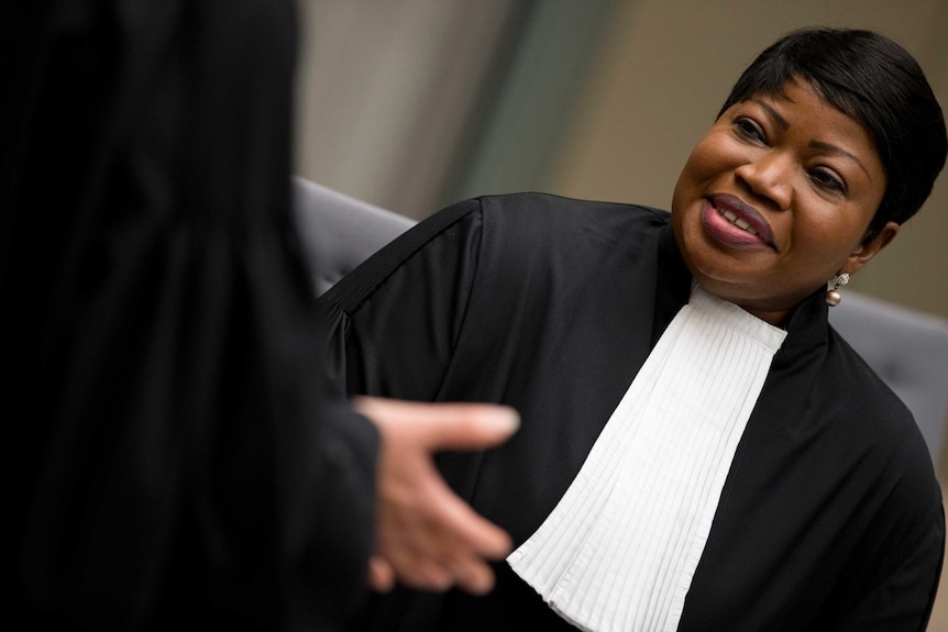 Fatou Bensouda smiles in court