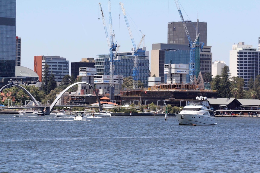 A view of Elizabeth Quay from across the river with construction of the hotel happening.