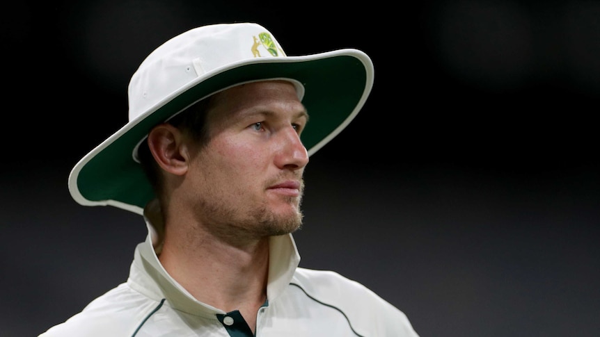 Cameron Bancroft looks off to one side wearing a wide-brimmed white hat