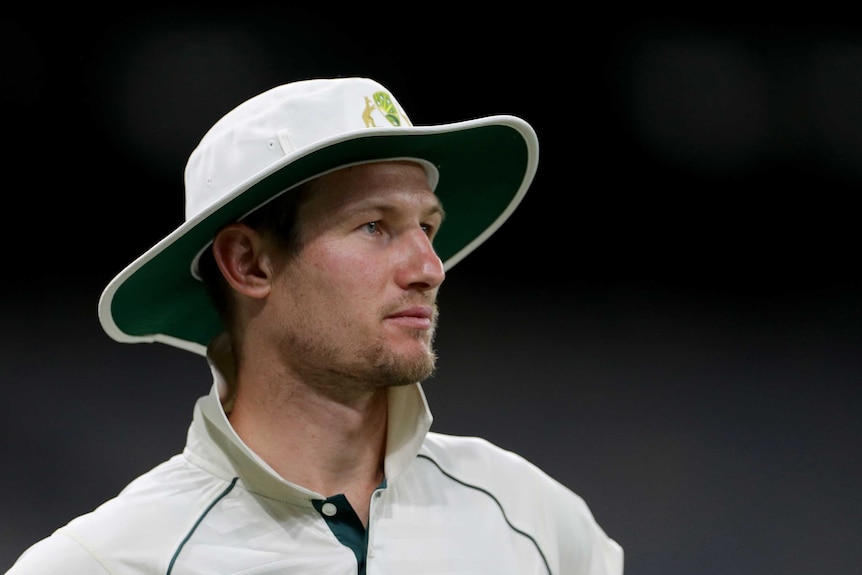 Cameron Bancroft looks off to one side wearing a wide-brimmed white hat