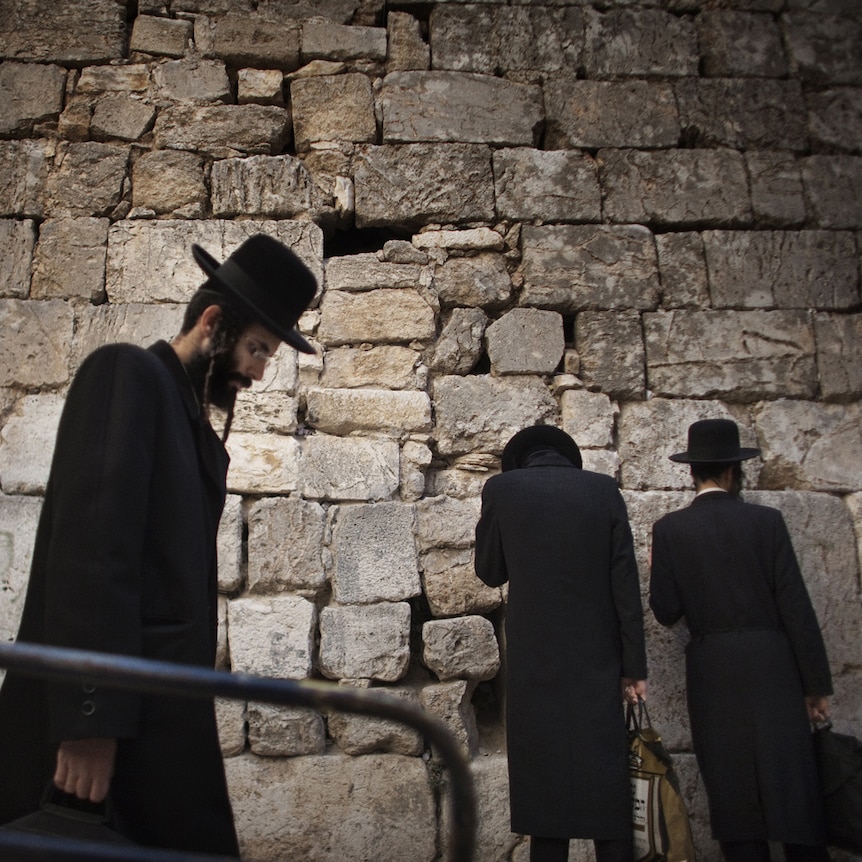 Ultra Orthodox Jews arrive for prayers at the Small Wailing Wall or Little Kotel in the Muslim Quarter of Jerusalem's Old City