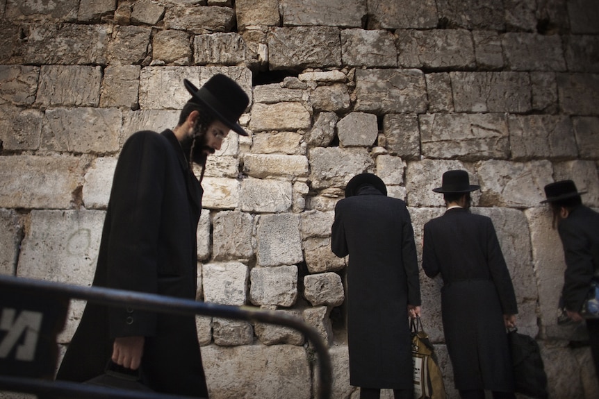 Ultra Orthodox Jews arrive for prayers at the Small Wailing Wall or Little Kotel in the Muslim Quarter of Jerusalem's Old City