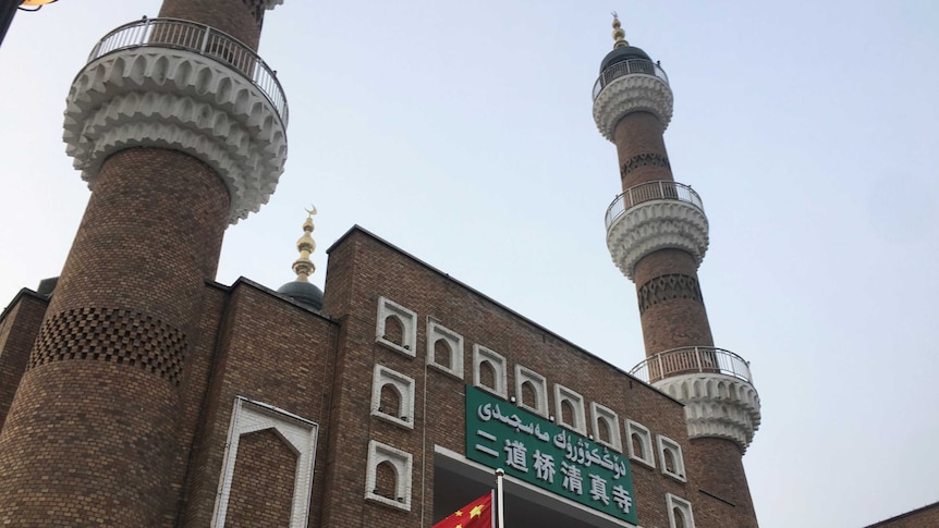 The Chinese national flag flies outside the mosque at the Xinjiang International Grand Bazar.