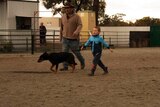 Dylan, 4, proudly walks his dog out after competing in the junior league at a yard dog trial in West Wyalong.
