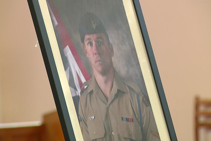 A framed photo of a soldier.