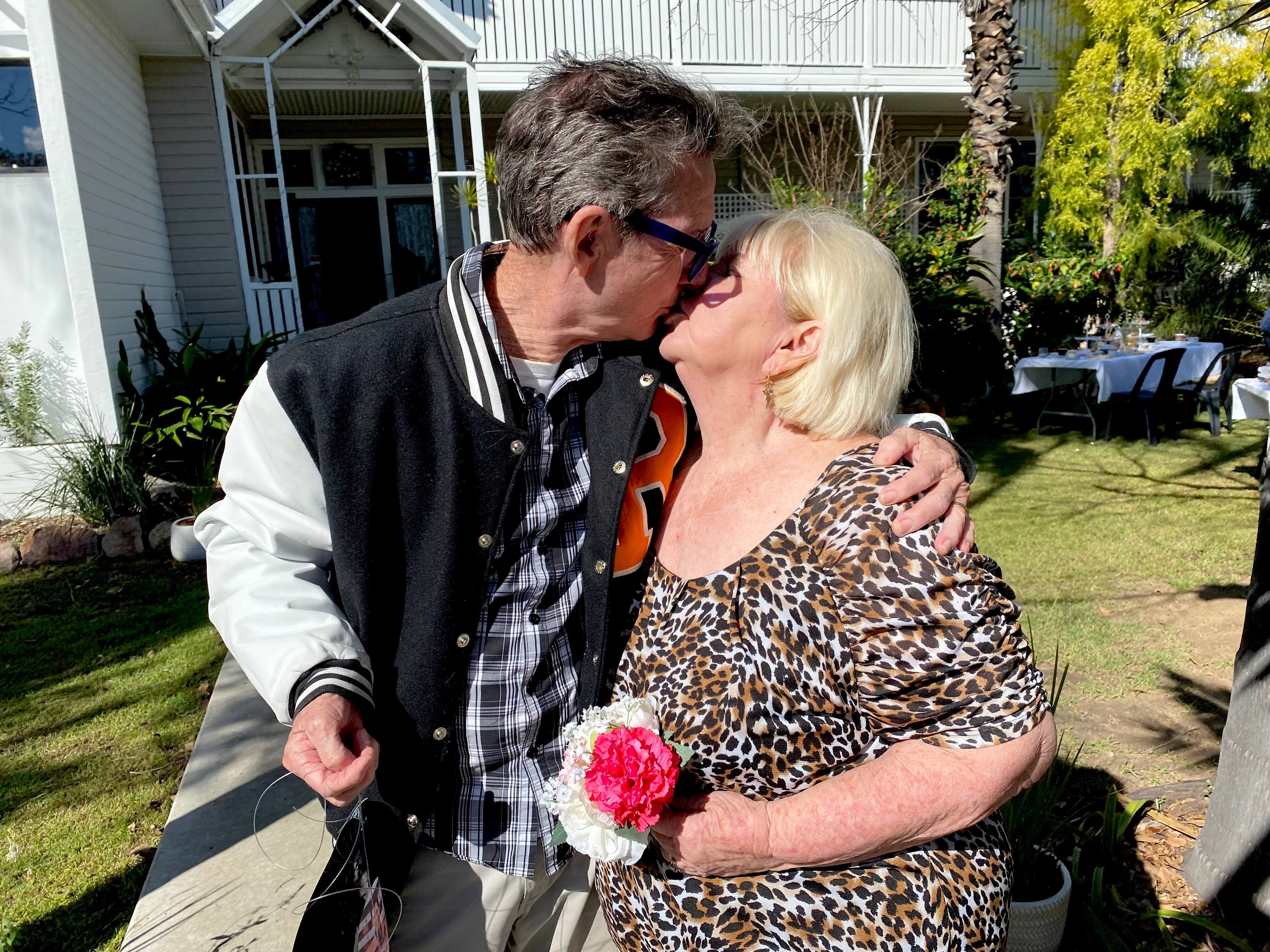 A man and woman kiss