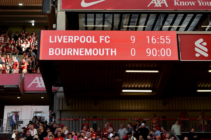An electronic scoreboard at a big English football ground at the end of a game reads 'Liverpool 9 Bournemouth 0'.