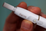 A close up of a Philip Morris iQOS e-cigarette.