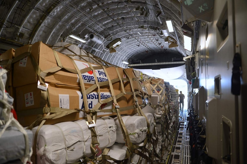 Australian aid packages for Vanuatu stacked inside Hercules aircraft