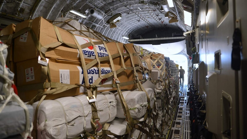 Australian aid packages for Vanuatu stacked inside Hercules aircraft