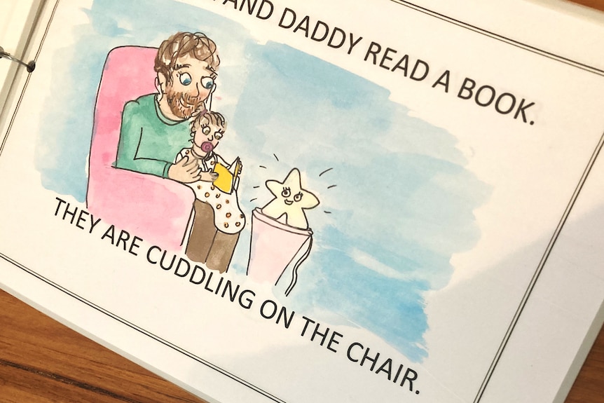 Page from homemade story book showing dad and toddler reading on chair