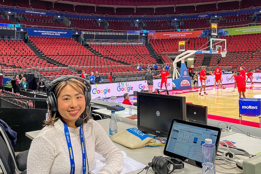 A woman commentating on a basketball game