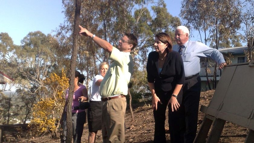 Anna Bligh, Robert Schwarten and Paul Hoolihan inspect fire damaged bushland in Rockhampton