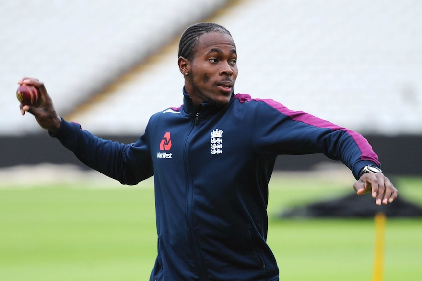 Jofra Archer readies to throw a cricket ball during an England training session