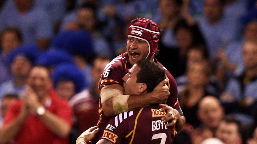 Darius Boyd (right) and Johnathan Thurston of the Maroons celebrate a try during this year's game one of State of Origin in Melbourne.