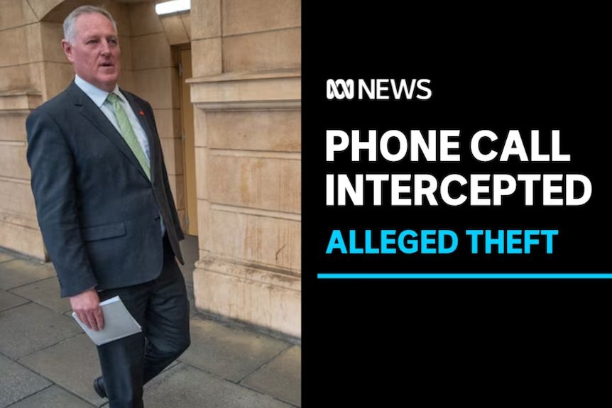 Phone Call Intercepted, Alleged Theft: A man in a suit walks down a street carrying a piece of paper.