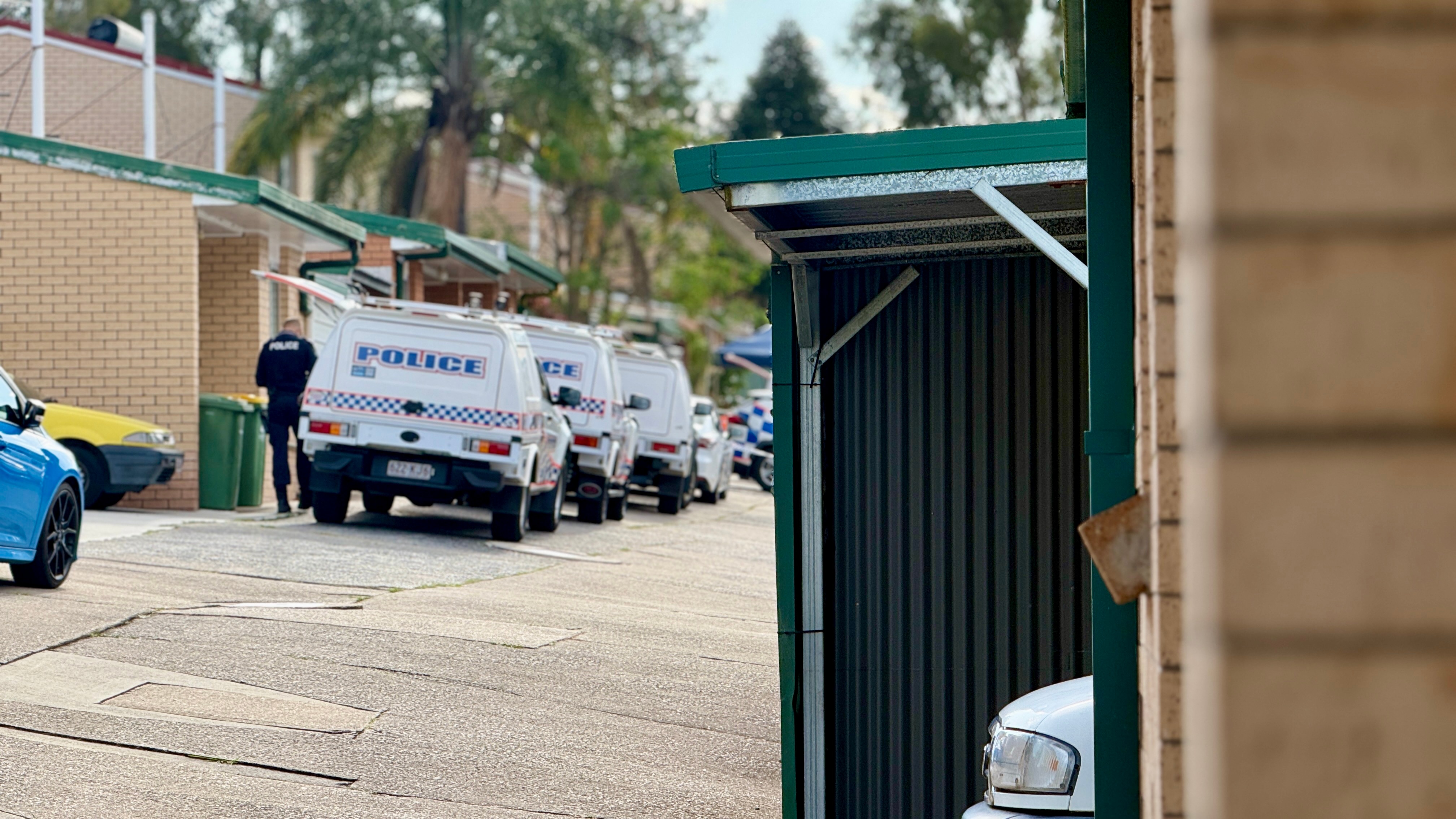 Man charged with murder after body found in Logan unit