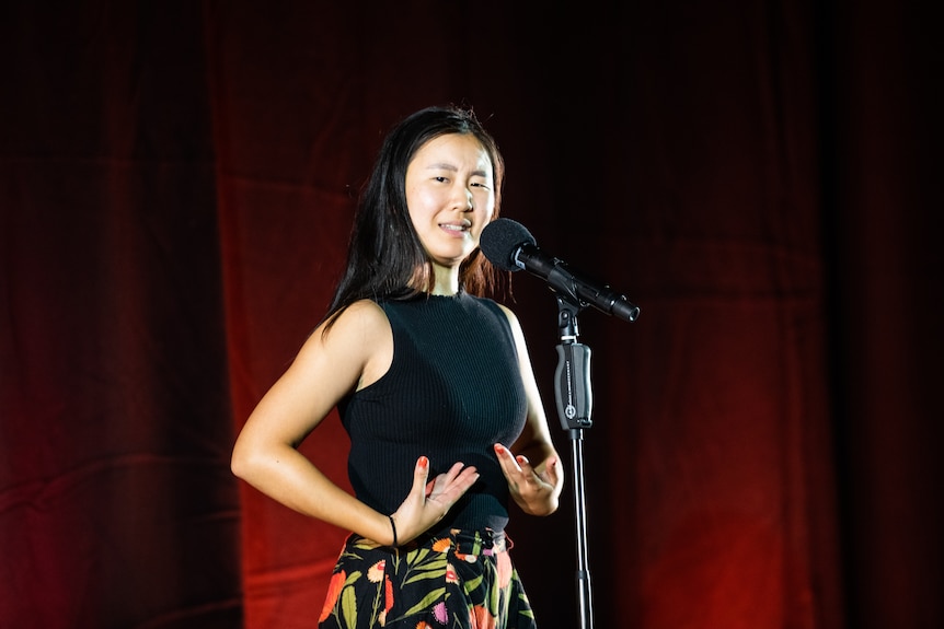 A woman recites poetry