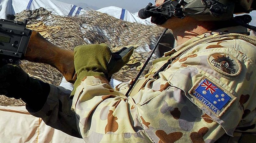 An Australian soldier patrols