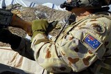 An Australian soldier patrols