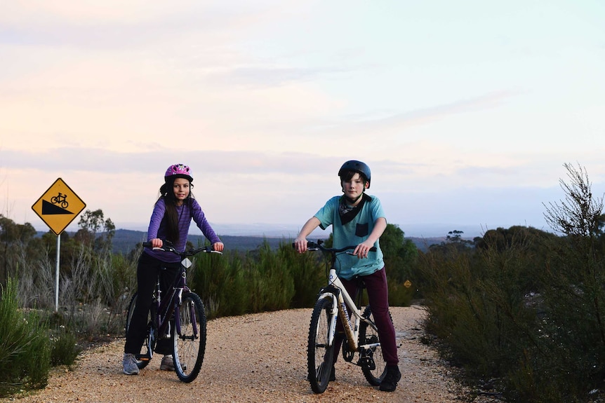 Two children on bicycles.