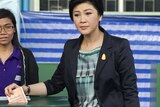 Thai caretaker Prime Minister Yingluck Shinawatra casts her ballot