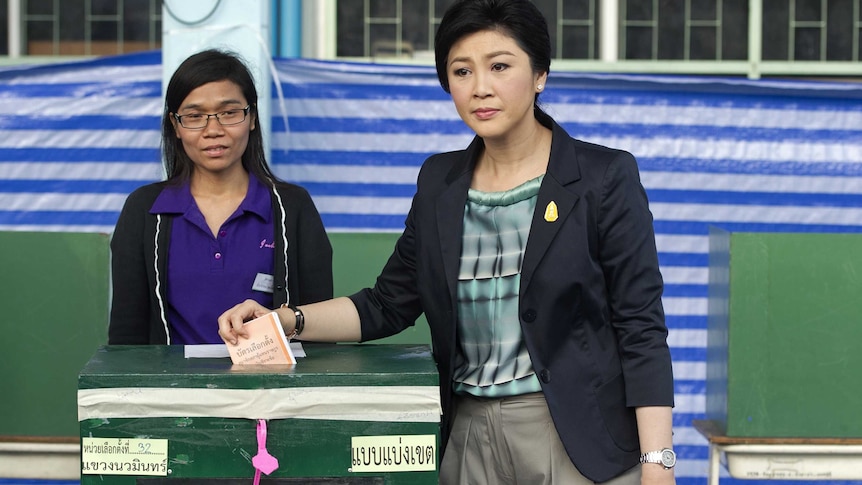 Thai caretaker Prime Minister Yingluck Shinawatra casts her ballot