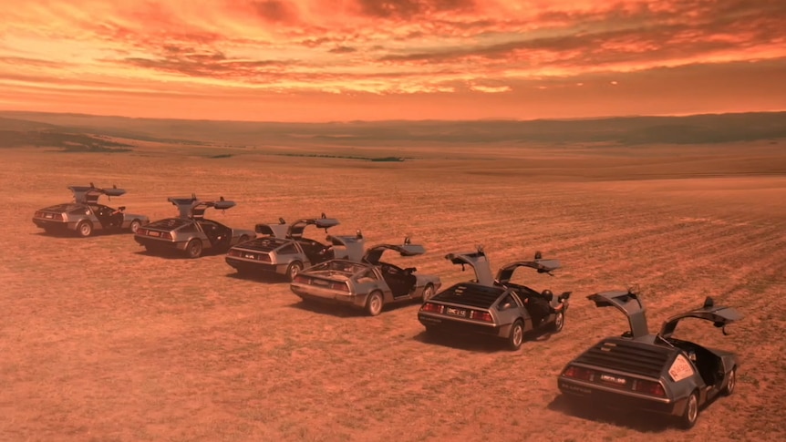A fleet of DeLoreans at Lake George, in the film Blue World Order