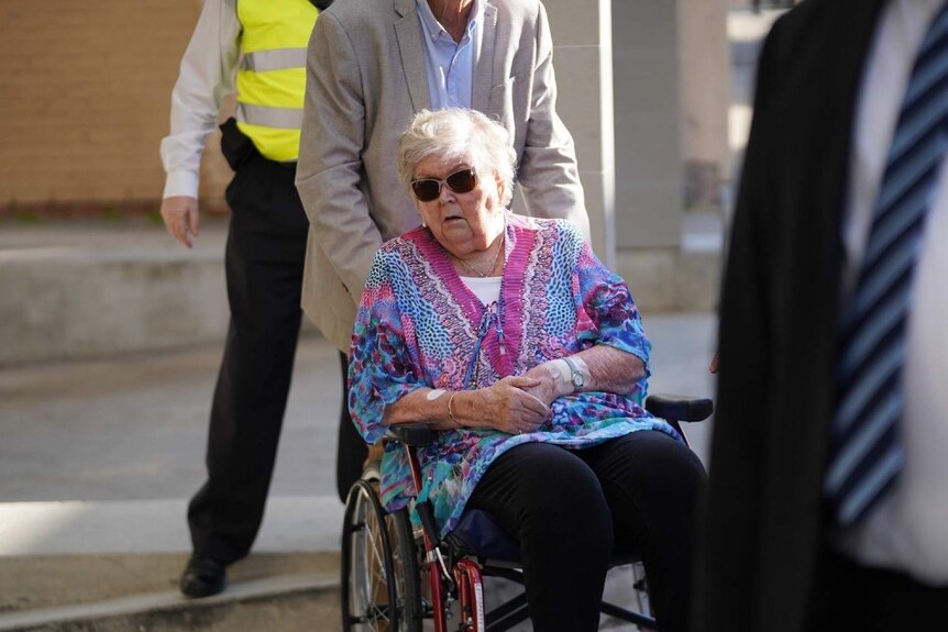 Jenny Rimmer in a wheelchair arriving at the court house.