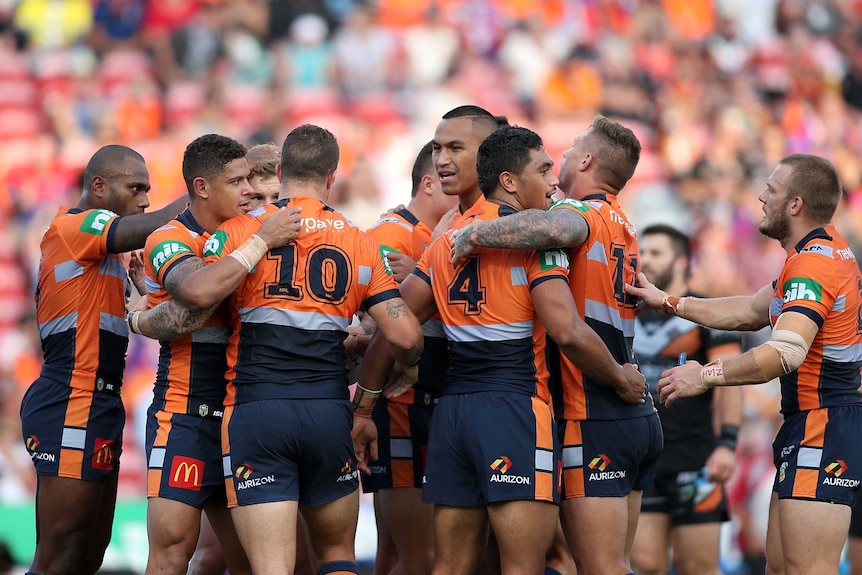 Newcastle Knights celebrate during a win over Wests Tigers