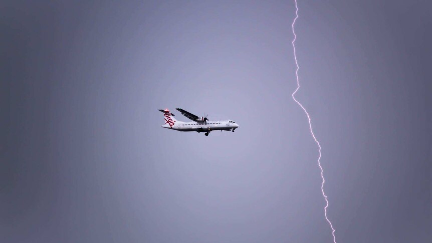 A lightening strike near a Virgin airplane.