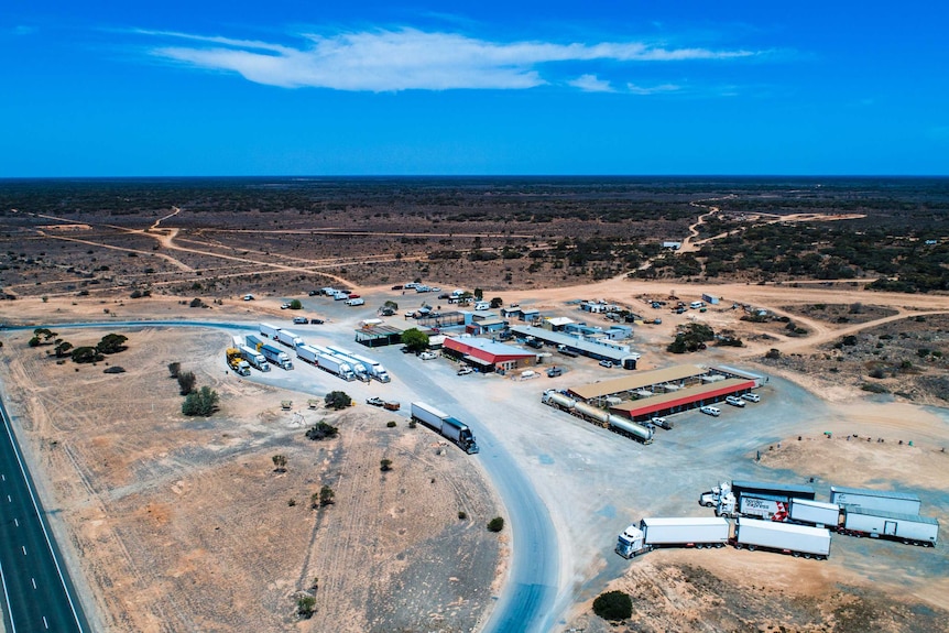 A drone photograph of a remote roadhouse on the Nullarbor