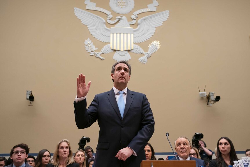 Michael Cohen, President Donald Trump's former personal lawyer, is sworn in to testify on Capitol Hill in Washington.
