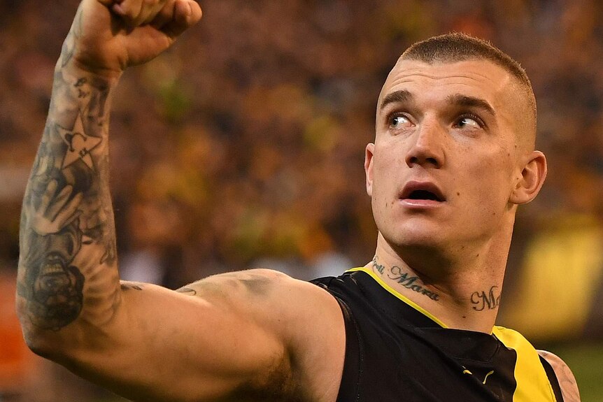 Dustin Martin of Richmond pumps his fist and looks skywards in the qualifying final against Geelong.